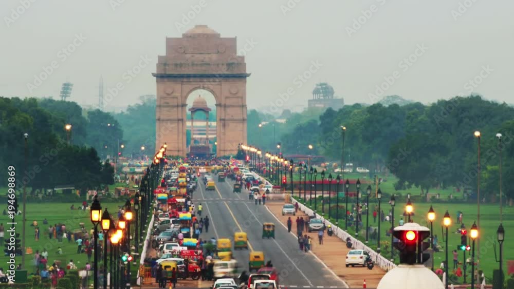 Delhi, India. Time-lapse of Car and people traffic to the India Gate in Delhi in the evening. Zoom in