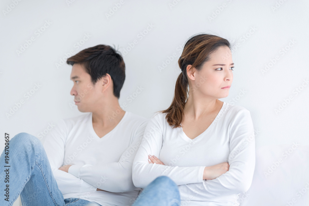 Young couple in bed having problem and unhappy. People with relationship difficulties conflict and family concept. Young couple in bed having problem and unhappy. People with relationship difficulties conflict and family concept.