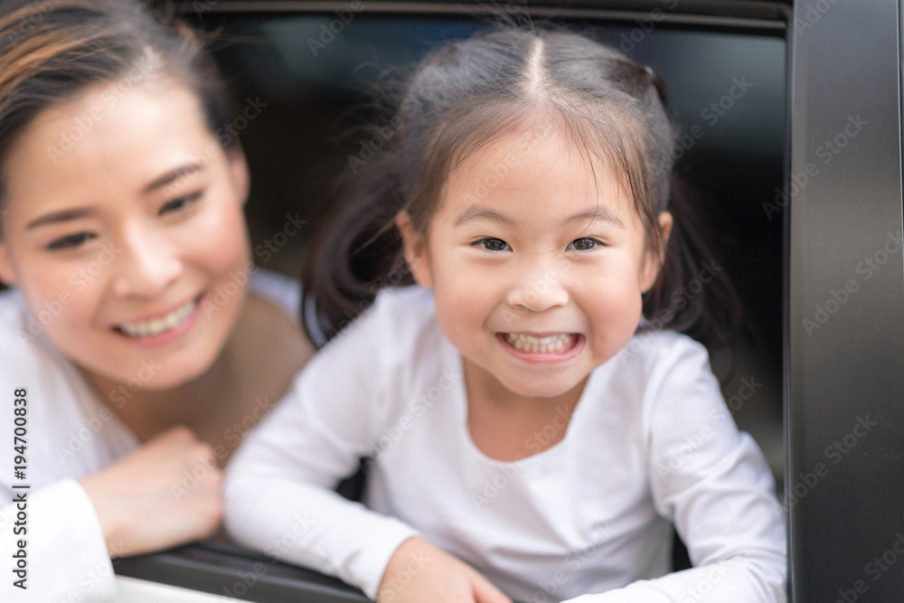 Happy man and woman with little child driving in car. Happy man and woman with little child driving in car.