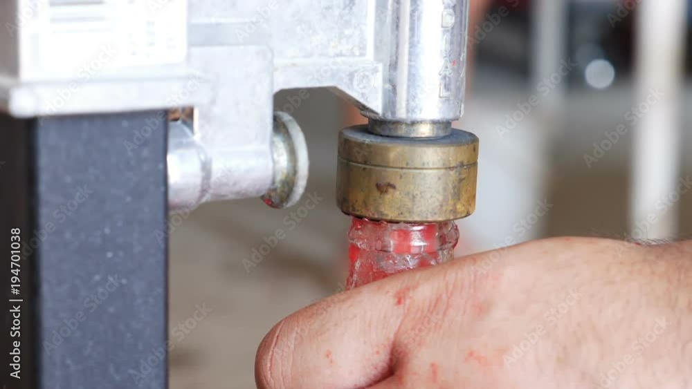 close up on Putting cap on tomato sauce glass bottle in South of Italy close up on Putting cap on tomato sauce glass bottle in South of Italy