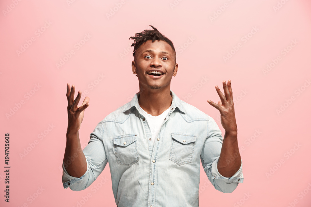 Winning success man happy ecstatic celebrating being a winner. Dynamic energetic image of male model Winning success man happy ecstatic celebrating being a winner. Dynamic energetic image of male model