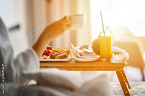 Breakfast in bed, cozy hotel room