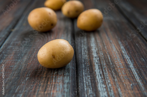 Baby potatoes on a table. Raw potatoes