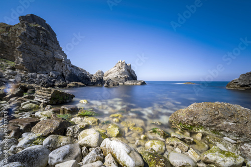long exposure shot on sea with rocks