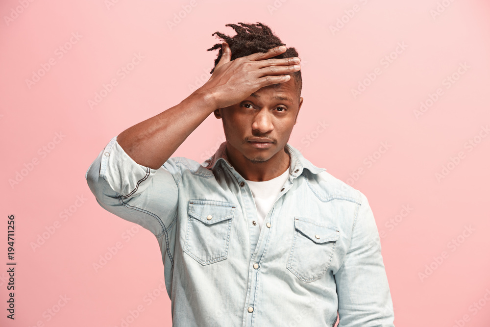 African American Man having headache. Isolated over pink background. African American Man having headache. Isolated over pink background.