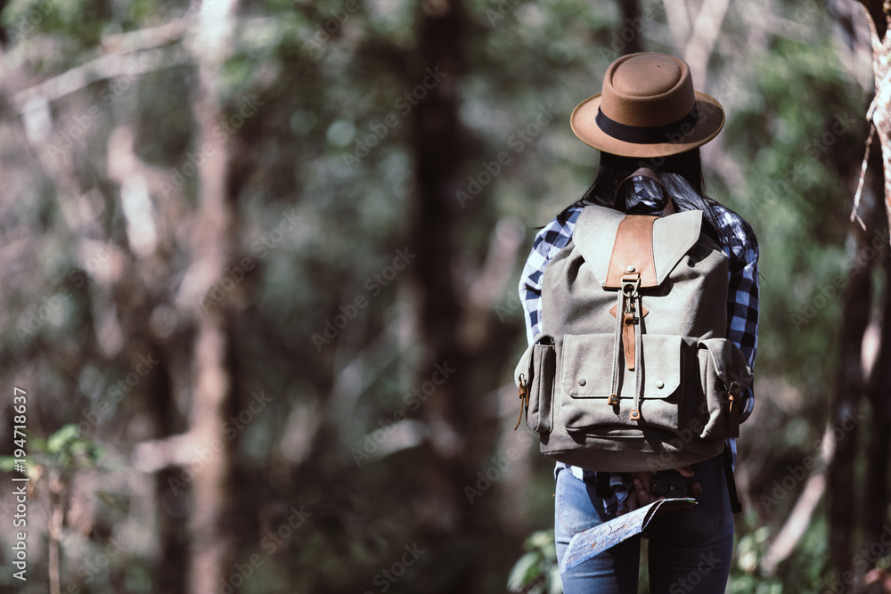 Happy female tourist to travel in wild trip hiking during vacation.Travel concept.