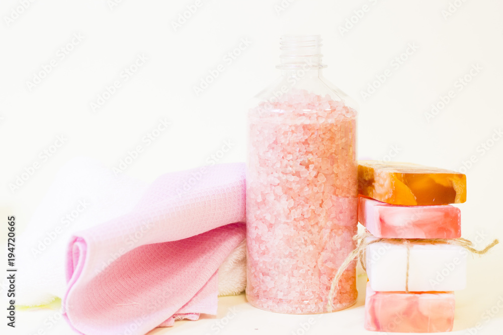 Aromatherapy spa concept. Rose sea salt, bars of soap, closeup Aromatherapy spa concept. Rose sea salt, bars of soap, closeup