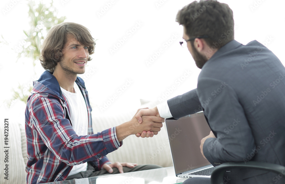 manager shakes hands with his client manager shakes hands with his client