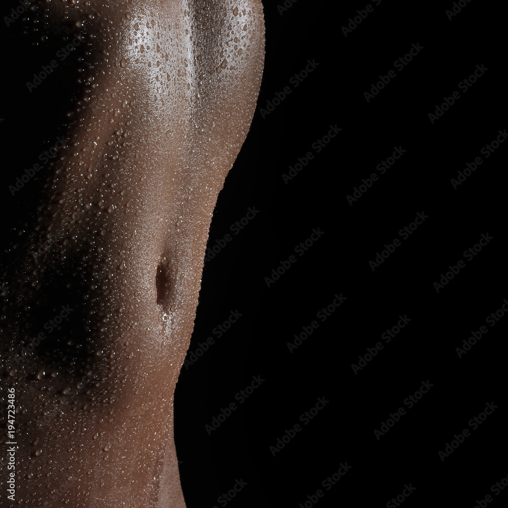 Fototapeta premium Bodyscape of a Nude wet belly
