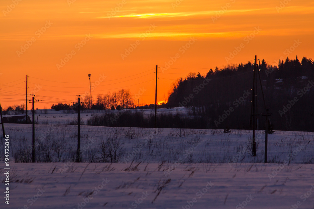 sunset in the winter frosty evening in the Russian outback sunset in the winter frosty evening in the Russian outback