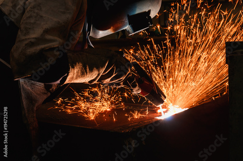 Welder arc Gouging carbon electrode rods with sparks and smoke