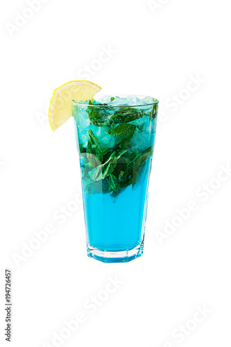 Blue Lagoon cocktail with a slice of lemon and mint isolated on white