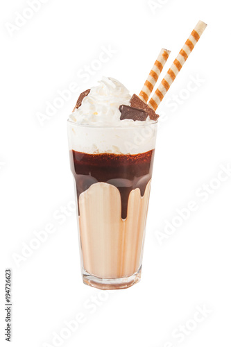 Chocolate milkshake with chunks of chocolate and cookies on top, isolated on white.