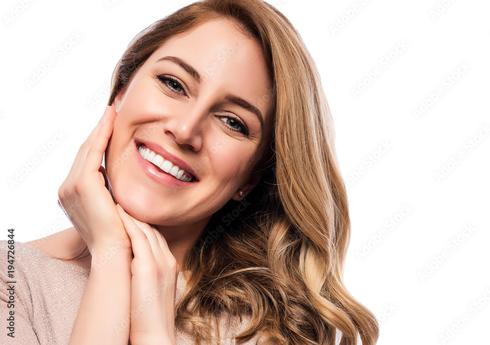 Attractive cute blonde. Close-up portrait on a white. Beautiful young woman in a flesh-colored dress.