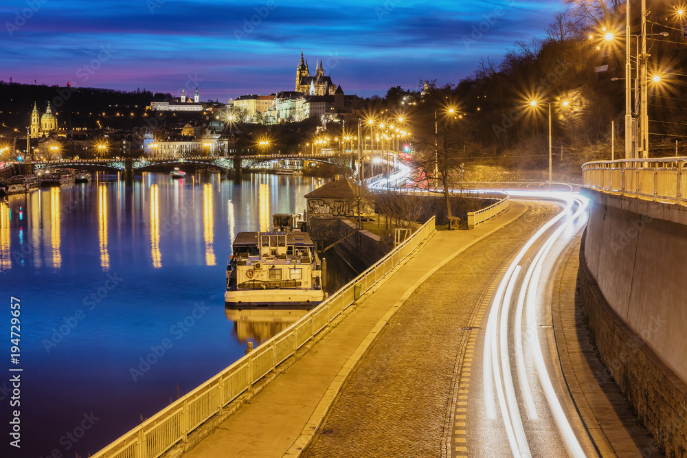 Highway to big city at night. Castle. Prague