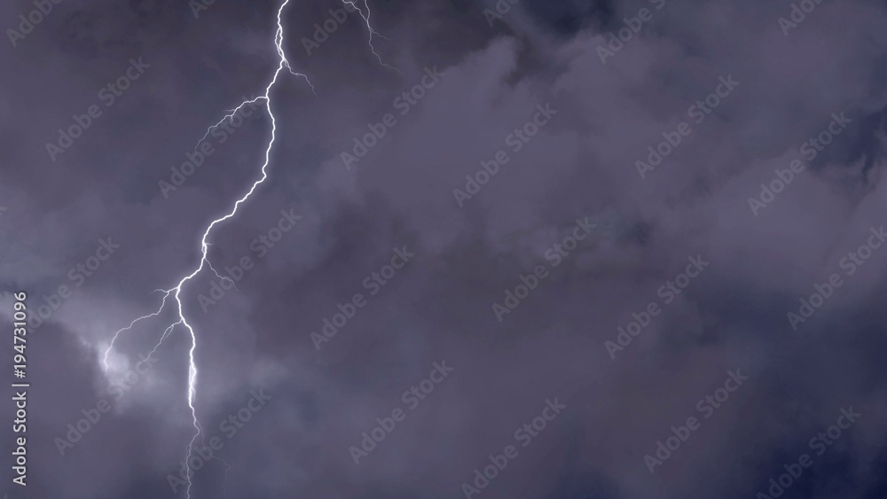 Powerful natural phenomenon, lightning forks striking in dark night sky Powerful natural phenomenon, lightning forks striking in dark night sky