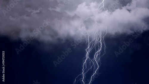 Thunder in sky, stroke of branched lightning shoots out of cloud, nature