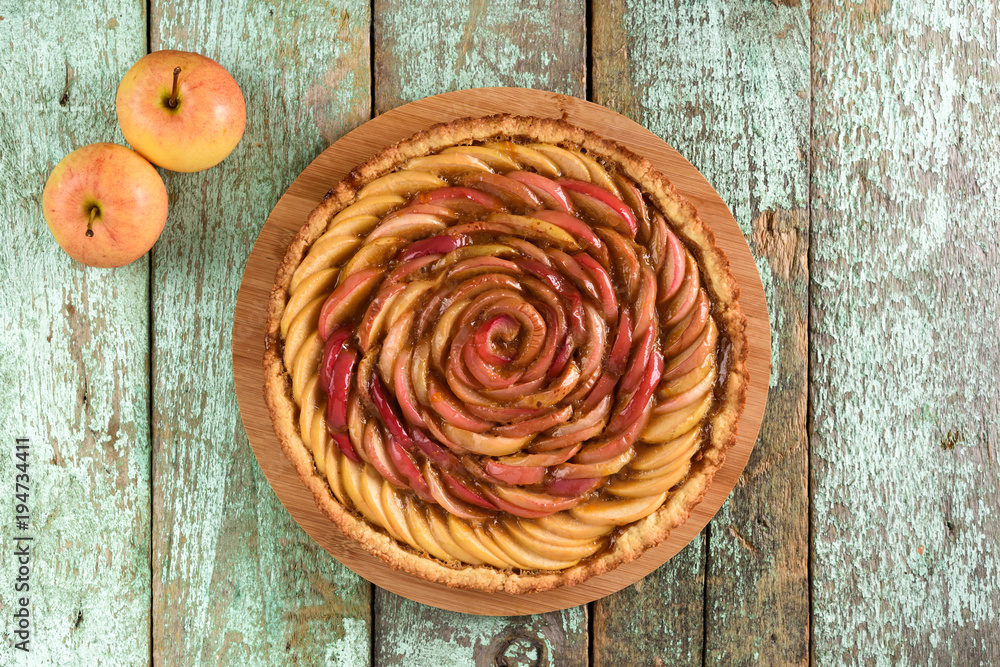 Homemade tasty apple rose pie on shabby blue rustic background Homemade tasty apple rose pie on shabby blue rustic background