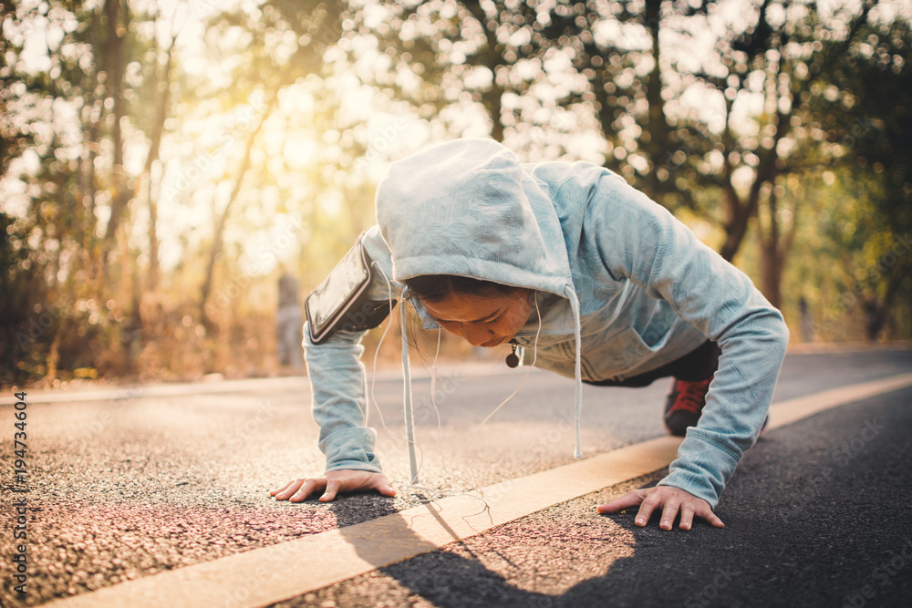 Woman warm up before running on the road for health, color of hipster tone selective and soft focus Woman warm up before running on the road for health, color of hipster tone selective and soft focus