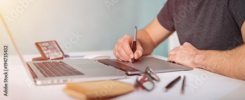 Graphic designer working using laptop