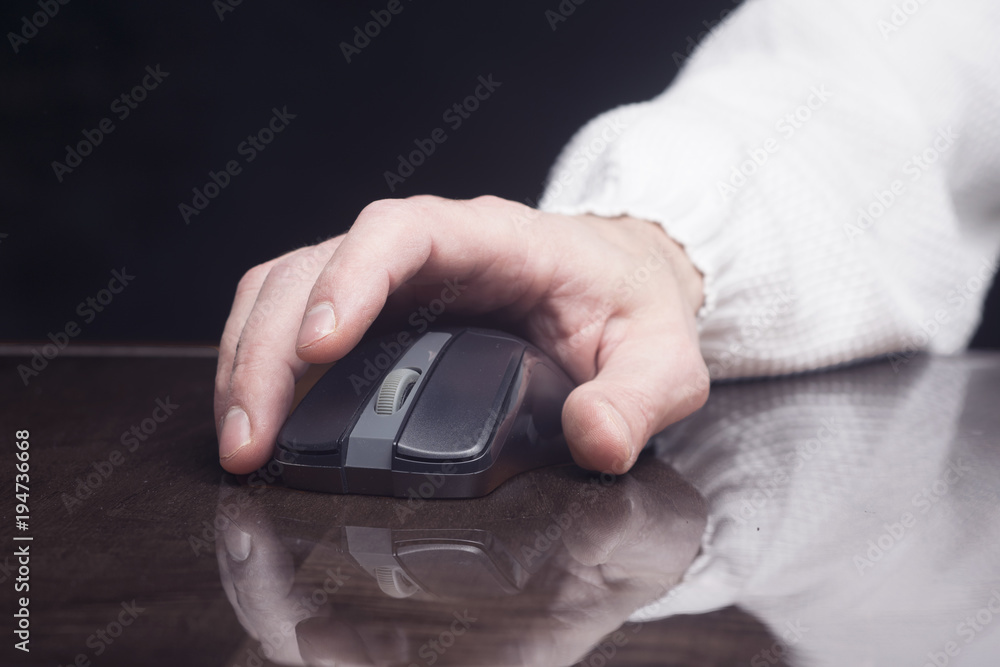 Fototapeta premium computer mouse in man's hand