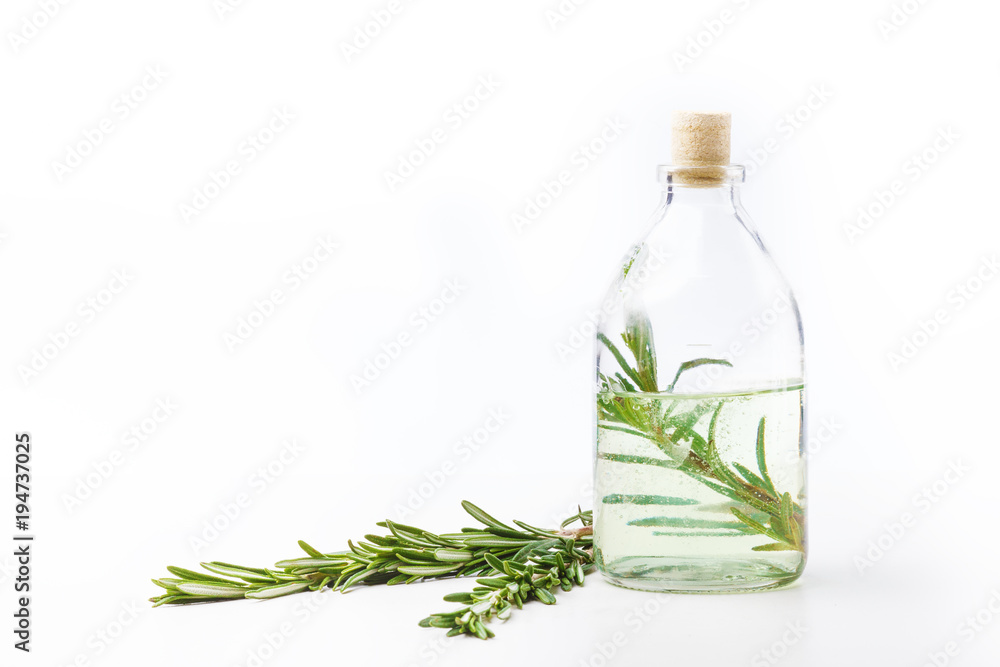 Aromatic oils in glass bottles on a white table. Body care. Healthy lifestyle. Isolated. Aromatic oils in glass bottles on a white table. Body care. Healthy lifestyle. Isolated.