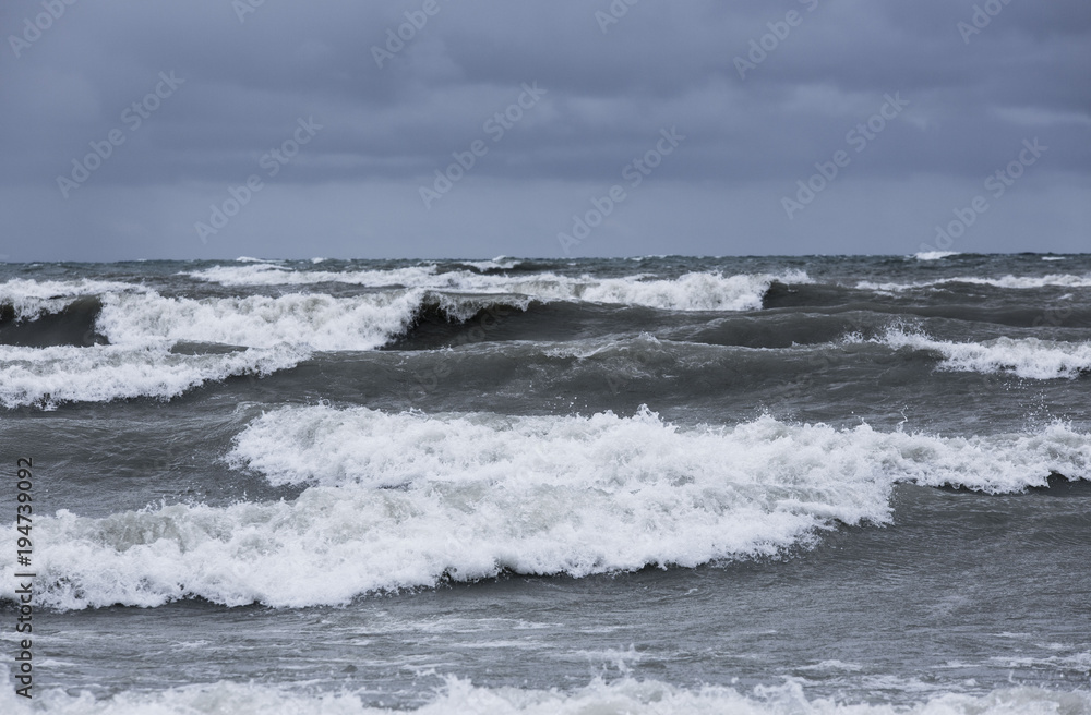 storm clouds and rough waves on the water