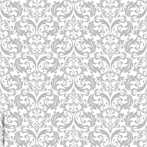 Wallpaper in the style of Baroque. A seamless vector background. White and grey floral ornament. Graphic vector pattern.