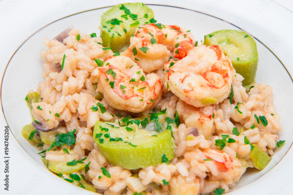 dish with risotto with prawns and zucchini dish with risotto with prawns and zucchini