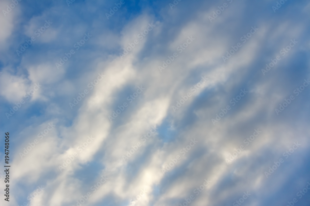 The sky is covered with snow-white fluffy clouds as a background The sky is covered with snow-white fluffy clouds as a background