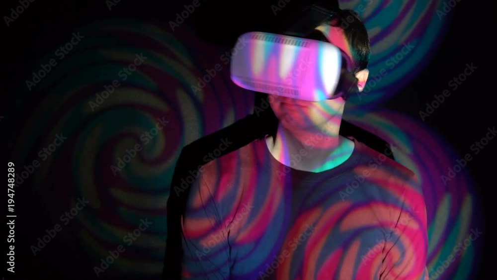 Young man in virtual reality headset says No. By shaking his head. Young man in virtual reality headset says No. By shaking his head.
