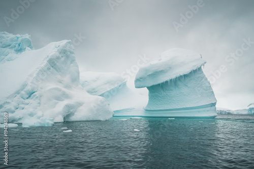 Ice Berg outstanding the Atlantic Ocean - Antarctica photo