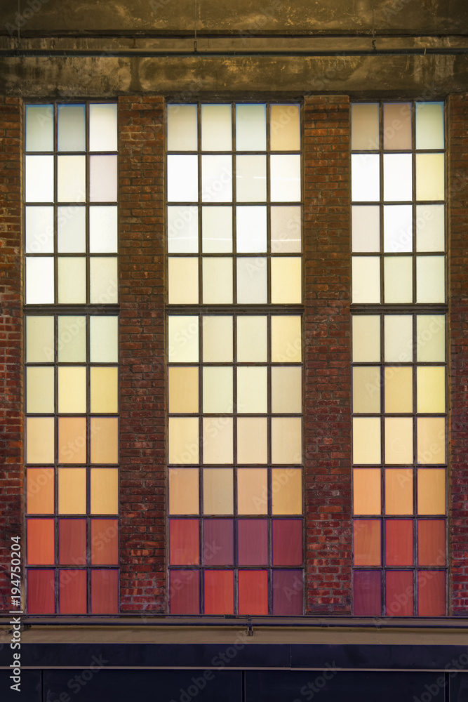Old colored windows with warm shades.