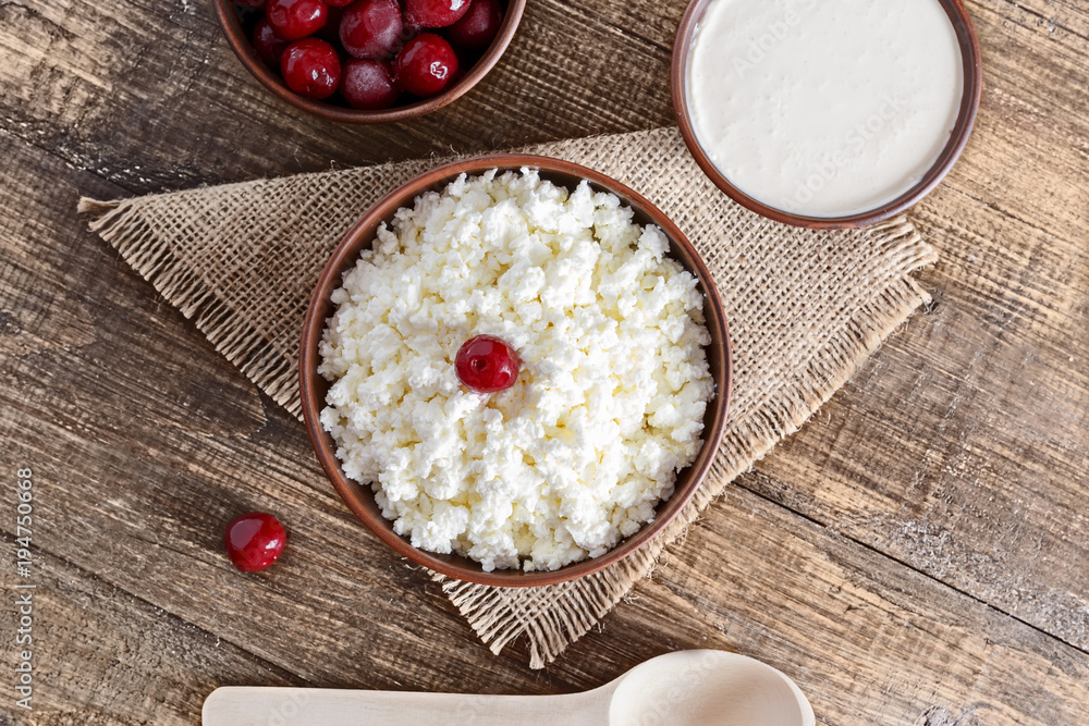 Cottage cheese on a wooden table close up