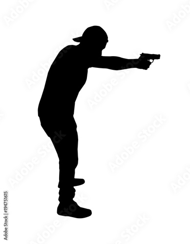 silhouette man  holding handgun in a shooting positionsilhouette man shoot gun
