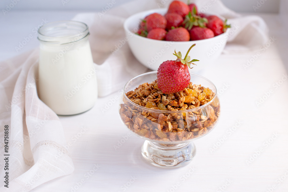 Homemade granola in jar on rustic kitchen table, healthy breakfa Homemade granola in jar on rustic kitchen table, healthy breakfa