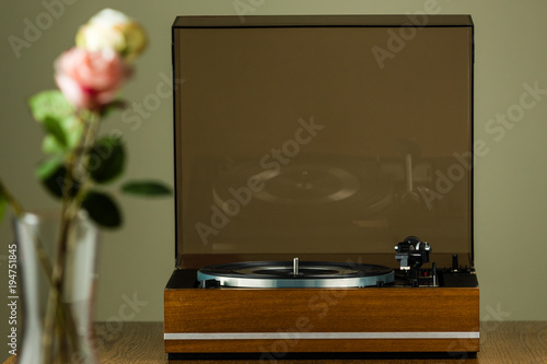 Vintage turntable playing a vinyl record