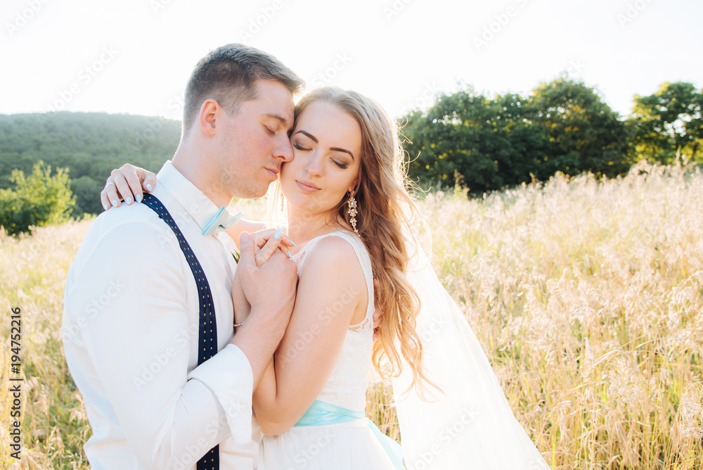 the bride and groom are photographed on the nature the bride and groom are photographed on the nature