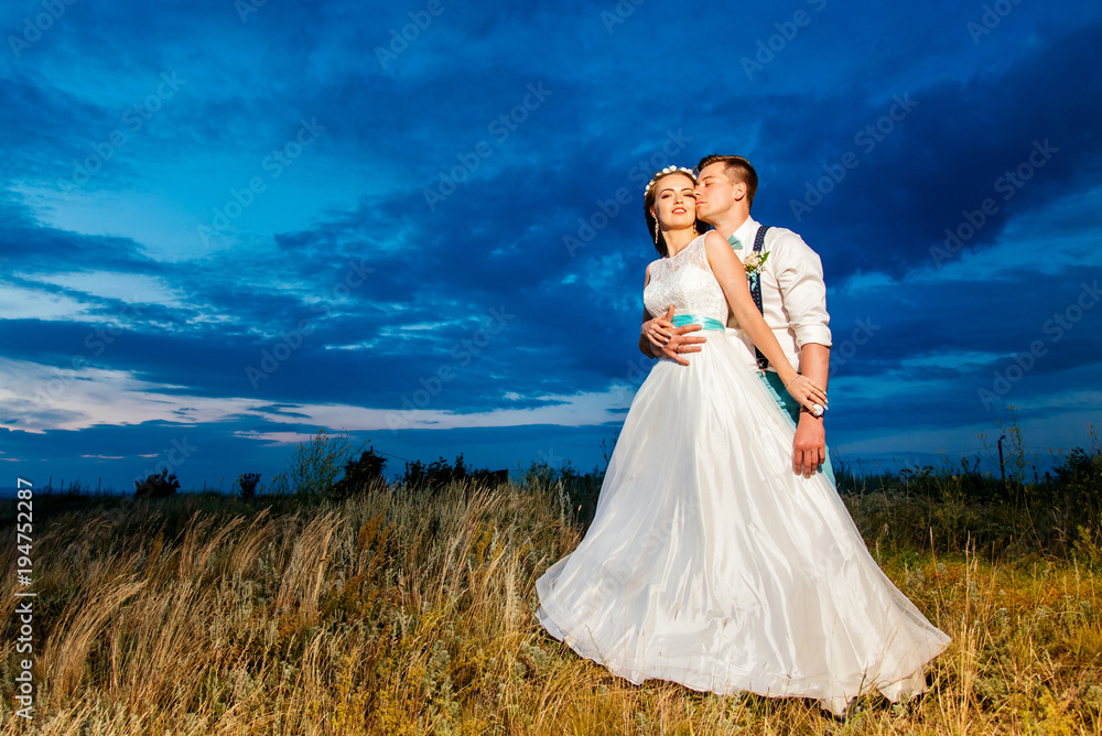 the bride and groom are photographed on the nature