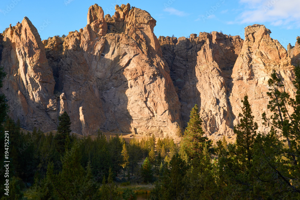 Dramatic natural formation view during the golden hour at sunset in Smith Rock State Park in Eastern Oregon USA Pacific Northwest.