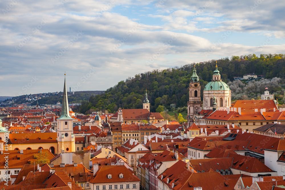 Obraz premium Bright sunset view of old town Mala Strana skyline from Hradcany castle. Skyline of Prague, Czech Republic