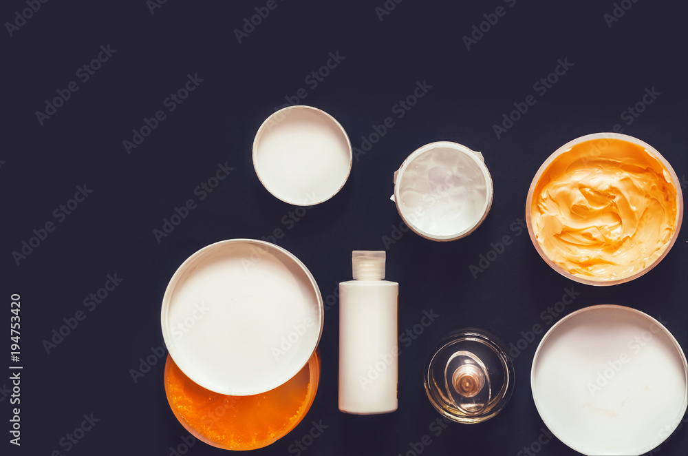 body care. cream, balm, milk, perfume. female set. view from above body care. cream, balm, milk, perfume. female set. view from above