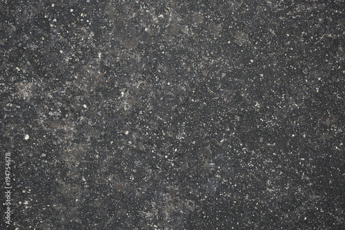 Background texture of old asphalt with gravel and moss