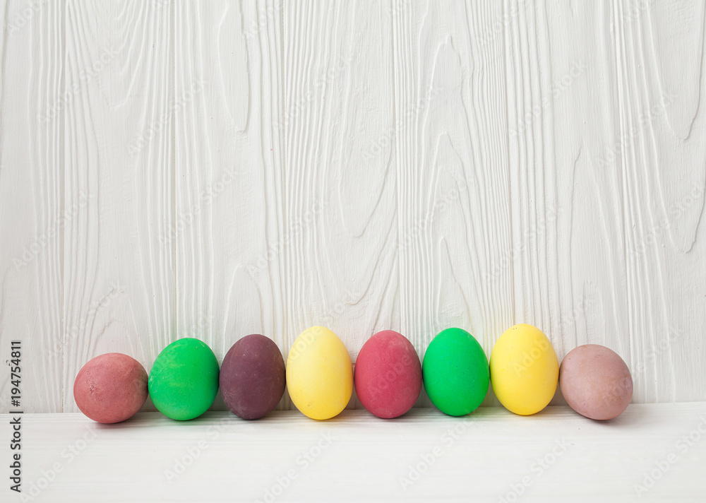 Colorful Easter eggs on white wooden background. Colorful Easter eggs on white wooden background.
