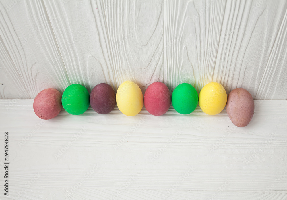 Colorful Easter eggs on white wooden background. Colorful Easter eggs on white wooden background.