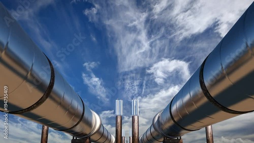 2 oil pipelines under blue sky with clouds