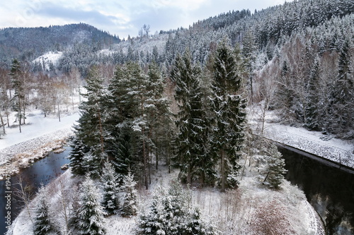 Beautiful snowy winter forest landscape, Tepla River under Brezova dam, Karlovy Vary, Czech Republic