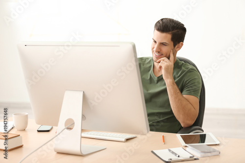 Young man working with comp...