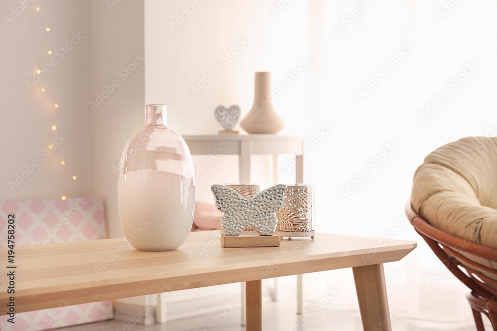 Wooden table with different decors in living room Wooden table with different decors in living room