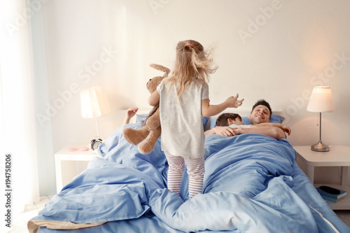 Cute awaken girl playing ne...
